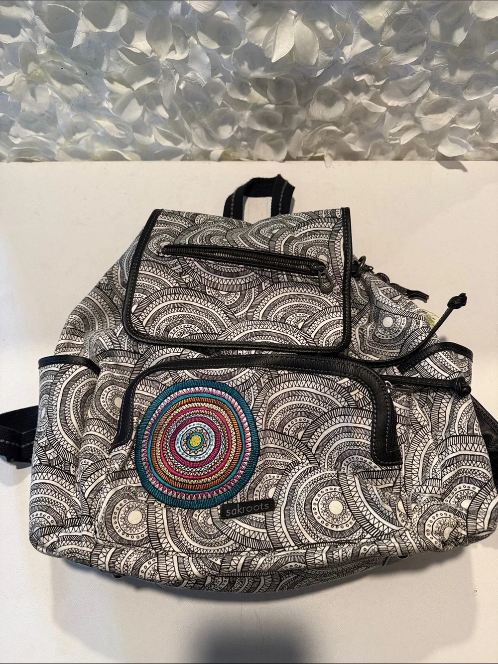 Sakroots Black & White Patterned Backpack with Multicolor Embroidered Circle